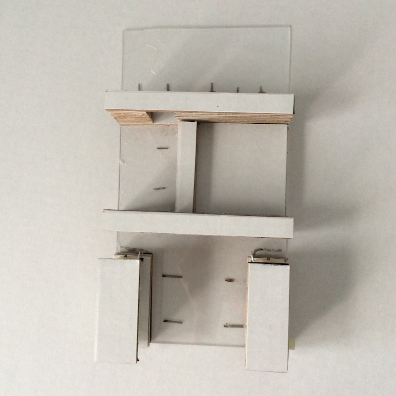 Cardboard pieces glued on plexiglass